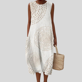 Robe en lin blanc avec motif ajouré