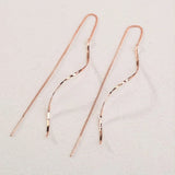 Boucles d'oreilles longues avec design ondulé